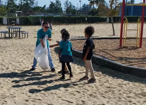 NHS Clean School event, children help clean a park.